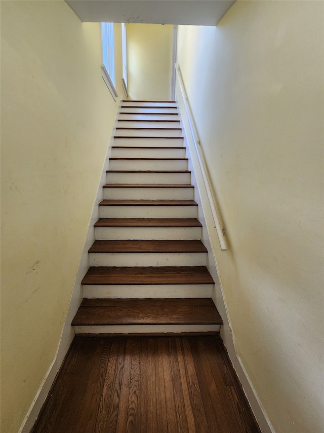 1634 Castle Ct, Houston, TX 77006 - stairs with baseboards and wood finished floors