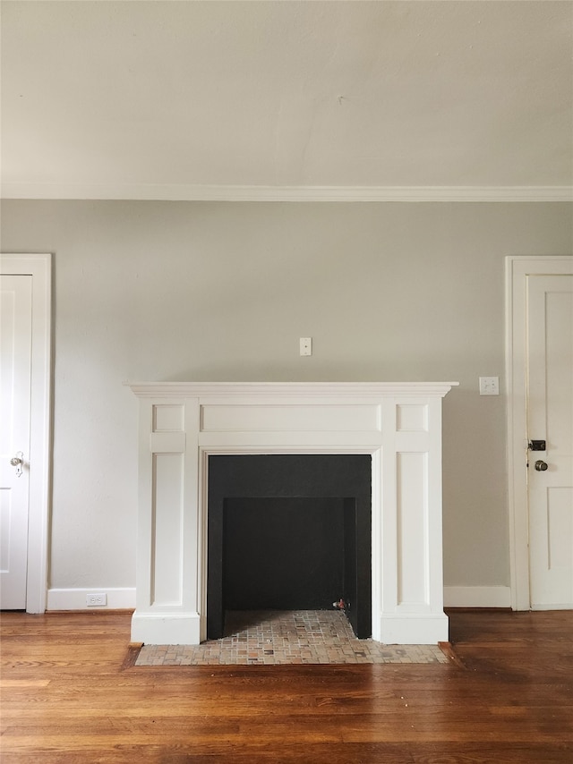 1634 Castle Ct, Houston, TX 77006 - detailed view of ornamental molding, wood finished floors, baseboards, and a fireplace with flush hearth