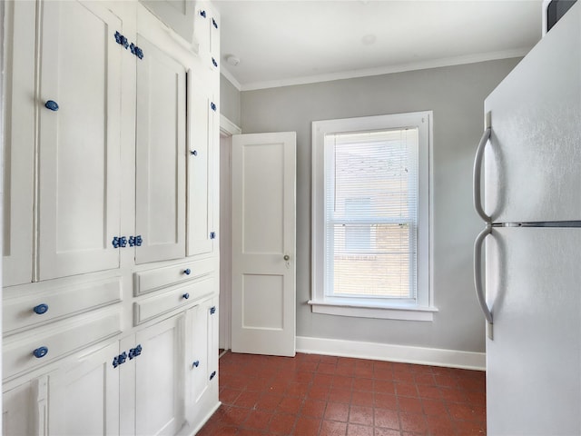 1634 Castle Ct, Houston, TX 77006 - hall with baseboards, dark tile patterned flooring, and ornamental molding