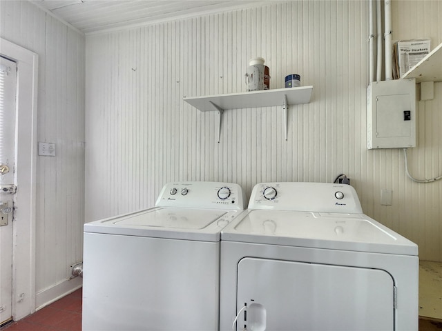1634 Castle Ct, Houston, TX 77006 - laundry room featuring electric panel, washer and clothes dryer, and wood walls