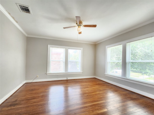 1634 Castle Ct, Houston, TX 77006 - empty room with plenty of natural light, wood finished floors, ceiling fan, baseboards, and ornamental molding