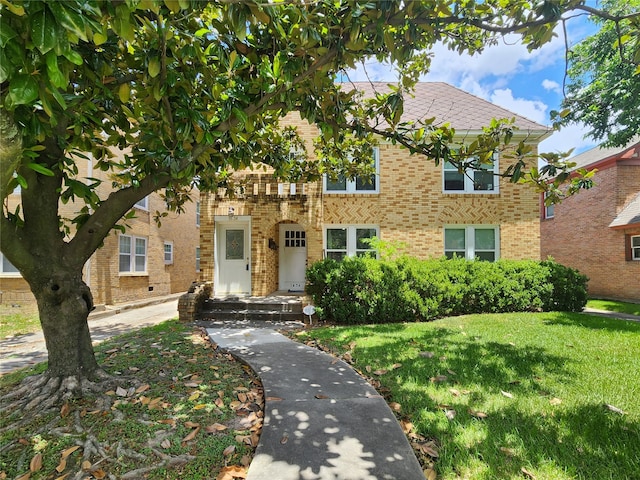 1634 Castle Ct, Houston, TX 77006 - view of front of home with brick siding and a front yard