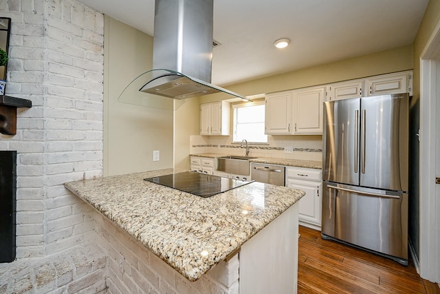 2730 Manila Ln, Houston, TX 77043 - kitchen featuring appliances with stainless steel finishes, island exhaust hood, a sink, and white cabinets