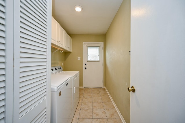 2730 Manila Ln, Houston, TX 77043 - washroom with separate washer and dryer, baseboards, and cabinet space