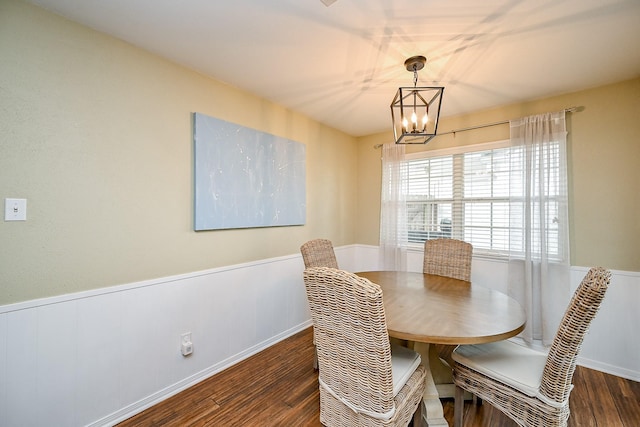 2730 Manila Ln, Houston, TX 77043 - dining area with wood finished floors, a chandelier, wainscoting, and baseboards