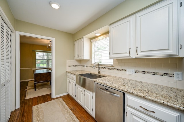 2730 Manila Ln, Houston, TX 77043 - kitchen featuring stainless steel dishwasher, a sink, dark wood-type flooring, white cabinets, and light stone countertops