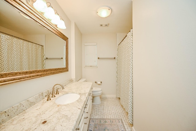 2730 Manila Ln, Houston, TX 77043 - full bathroom featuring vanity, tile patterned flooring, toilet, and baseboards