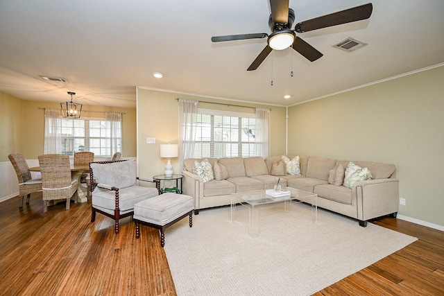 2730 Manila Ln, Houston, TX 77043 - living room featuring crown molding, wood finished floors, a ceiling fan, a chandelier, and baseboards