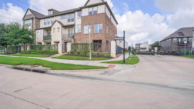 9423 Towne Lake Pkwy, Cypress, TX 77433 - townhome / multi-family property with a residential view and stone siding