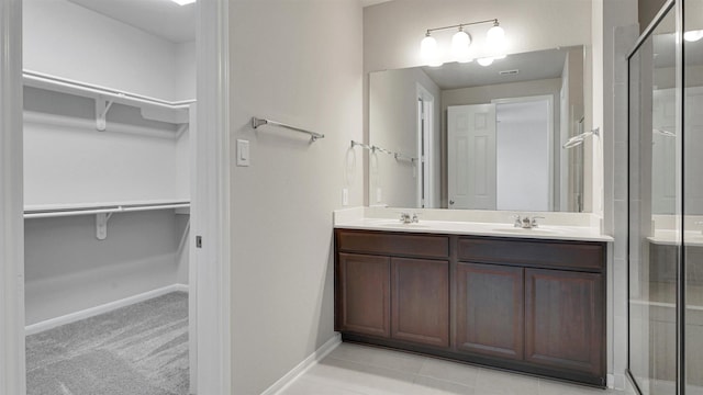 9423 Towne Lake Pkwy, Cypress, TX 77433 - full bath with double vanity, a walk in closet, and a shower stall