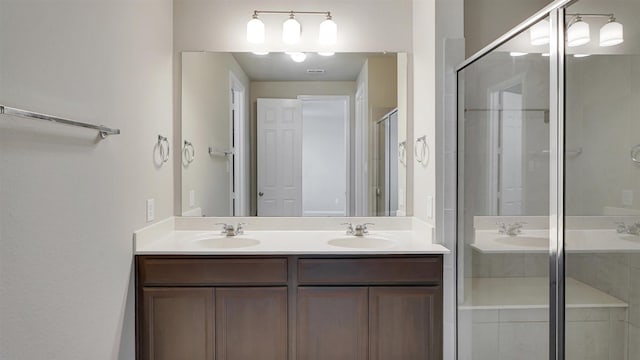 9423 Towne Lake Pkwy, Cypress, TX 77433 - bathroom with double vanity and a shower stall