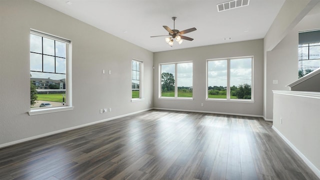 9423 Towne Lake Pkwy, Cypress, TX 77433 - empty room featuring a ceiling fan and dark wood finished floors