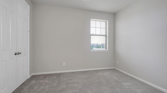9423 Towne Lake Pkwy, Cypress, TX 77433 - unfurnished bedroom featuring carpet floors and a closet