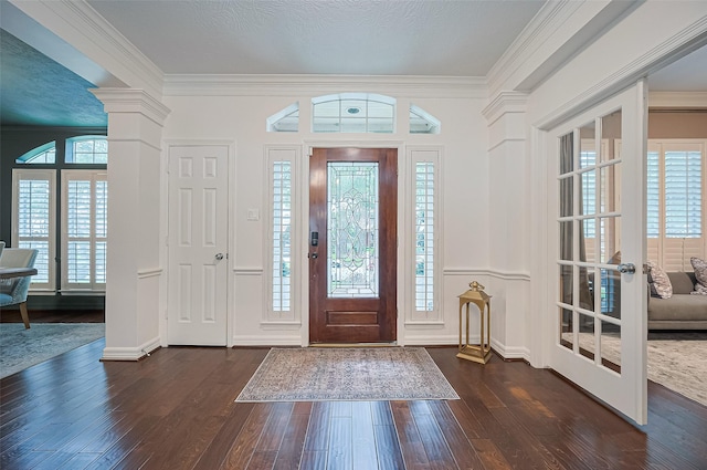 1942 Crisfield Dr, Sugar Land, TX 77479 - entryway with dark wood-style flooring, plenty of natural light, and ornamental molding