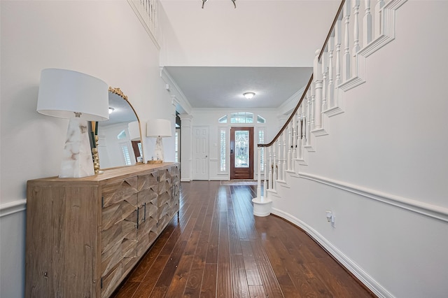 1942 Crisfield Dr, Sugar Land, TX 77479 - foyer entrance featuring dark wood-type flooring, ornamental molding, and stairway