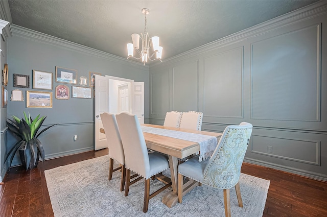 1942 Crisfield Dr, Sugar Land, TX 77479 - dining space with a chandelier, a decorative wall, dark wood-style floors, and ornamental molding