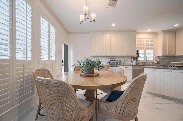 1942 Crisfield Dr, Sugar Land, TX 77479 - dining space with light marble finish floors, a chandelier, recessed lighting, and ornamental molding