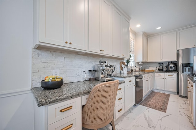 1942 Crisfield Dr, Sugar Land, TX 77479 - kitchen with appliances with stainless steel finishes, recessed lighting, white cabinets, and decorative backsplash