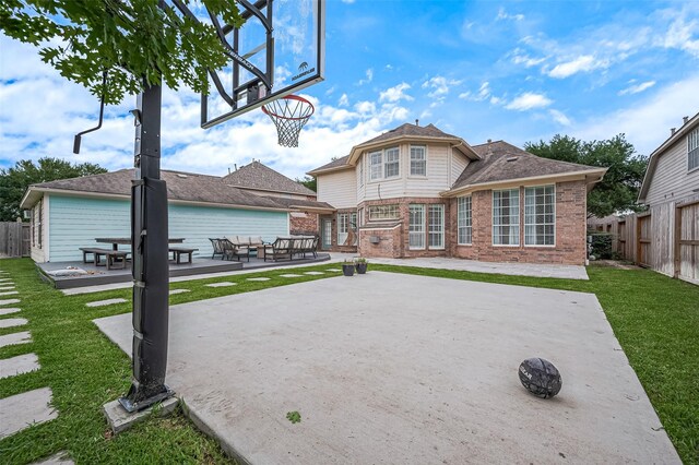 1942 Crisfield Dr, Sugar Land, TX 77479 - rear view of house featuring brick siding, a patio, and outdoor lounge area