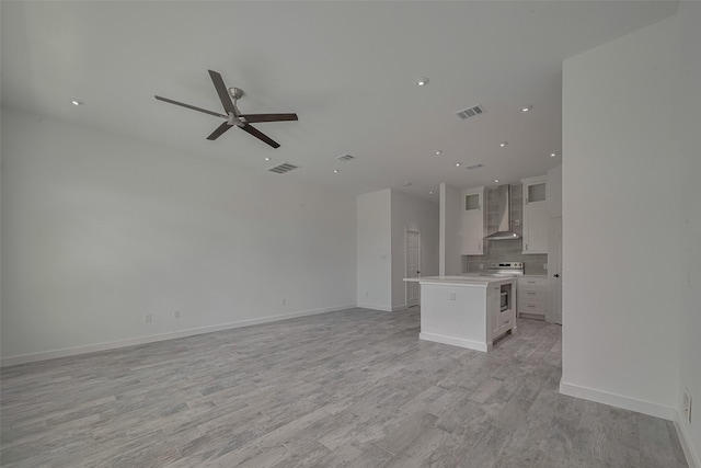 4116 Alvin St, Houston, TX 77051 - unfurnished living room with ceiling fan, light wood-style flooring, and recessed lighting