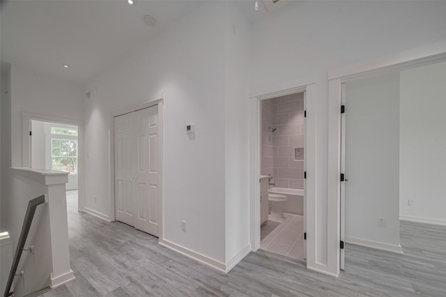 4116 Alvin St, Houston, TX 77051 - hallway with light wood finished floors and an upstairs landing