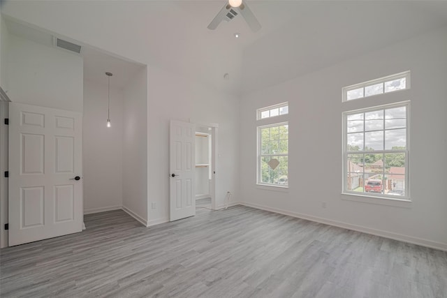 4116 Alvin St, Houston, TX 77051 - empty room featuring light wood finished floors, ceiling fan, and a high ceiling