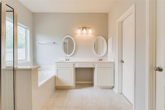 3402 Pebble Beach Ln, Pearland, TX 77584 - bathroom featuring a garden tub, tile patterned floors, and double vanity