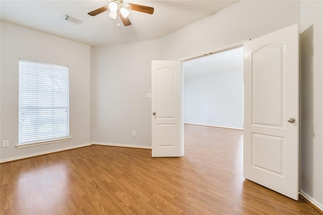3402 Pebble Beach Ln, Pearland, TX 77584 - empty room featuring a ceiling fan, light wood-style floors, and baseboards