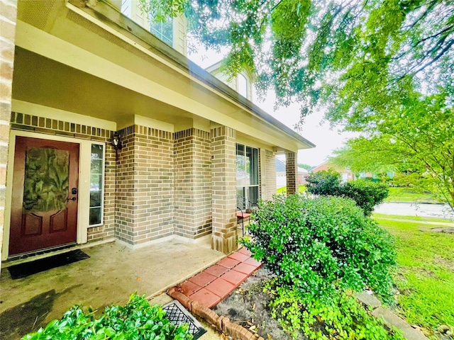 20702 Dappled Ridge Way, Humble, TX 77338 - doorway to property with brick siding