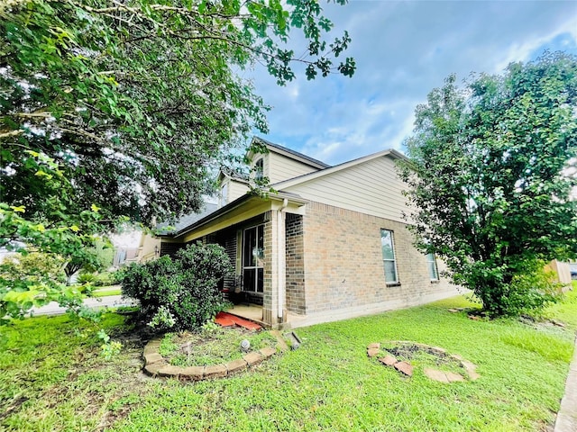 20702 Dappled Ridge Way, Humble, TX 77338 - view of side of property with brick siding and a yard