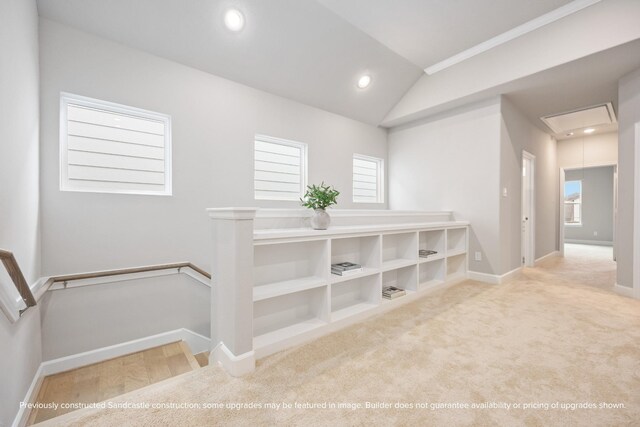 833 Fisher St Unit E, Houston, TX 77018 - corridor featuring attic access, an upstairs landing, vaulted ceiling, baseboards, and carpet flooring