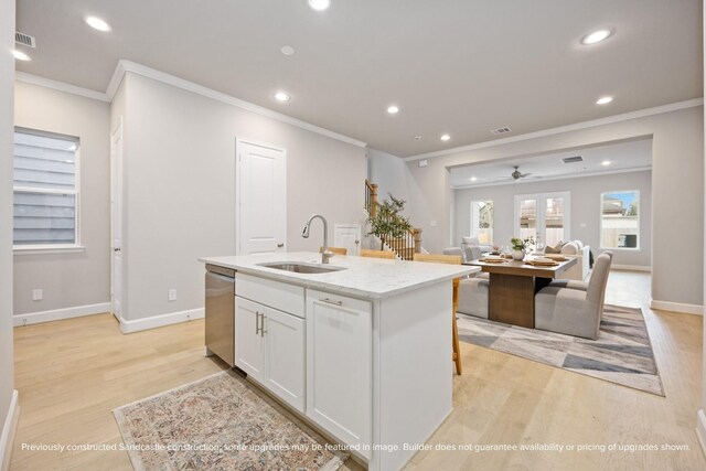 833 Fisher St Unit E, Houston, TX 77018 - kitchen featuring a sink, light wood finished floors, stainless steel dishwasher, ornamental molding, and recessed lighting