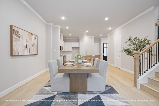 833 Fisher St Unit E, Houston, TX 77018 - dining room with crown molding, stairway, light wood-style floors, baseboards, and recessed lighting