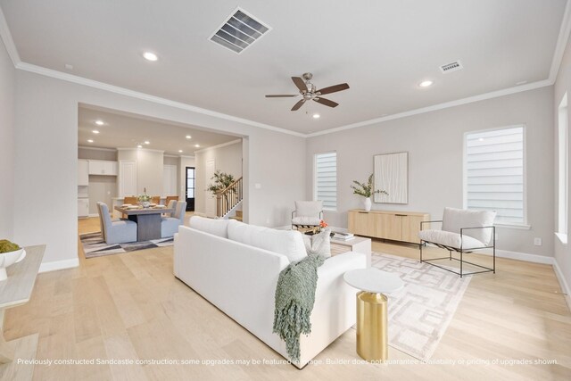 833 Fisher St Unit E, Houston, TX 77018 - living room with light wood-style floors, recessed lighting, stairs, ornamental molding, and a ceiling fan