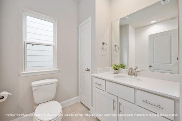 833 Fisher St Unit E, Houston, TX 77018 - bathroom with toilet, vanity, tile patterned flooring, and baseboards