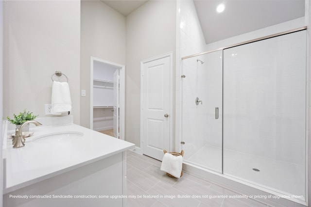 833 Fisher St Unit E, Houston, TX 77018 - full bathroom with a stall shower, vanity, a spacious closet, recessed lighting, and tile patterned floors