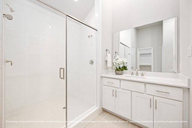 833 Fisher St Unit E, Houston, TX 77018 - full bathroom with a stall shower, vanity, tile patterned flooring, and a walk in closet