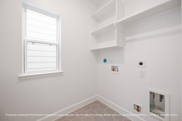 833 Fisher St Unit E, Houston, TX 77018 - washroom with electric dryer hookup, baseboards, hookup for a washing machine, dark tile patterned flooring, and hookup for a gas dryer