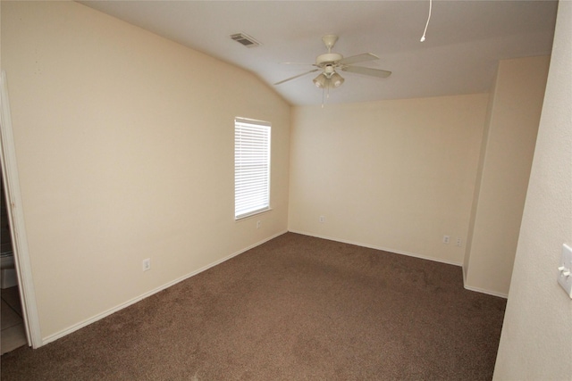 16218 Bresslyn, Cypress, TX 77429 - spare room featuring dark carpet, ceiling fan, vaulted ceiling, and baseboards