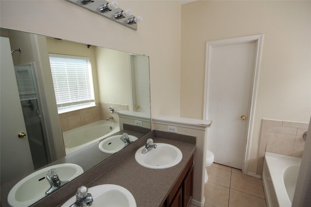 16218 Bresslyn, Cypress, TX 77429 - bathroom featuring a bath, double vanity, tile patterned floors, and toilet