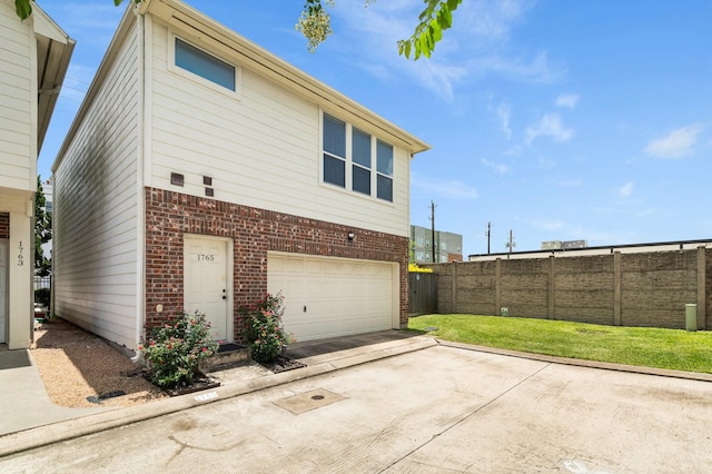 1765 Aden Dr, Houston, TX 77003 - back of house with brick siding, concrete driveway, and a garage