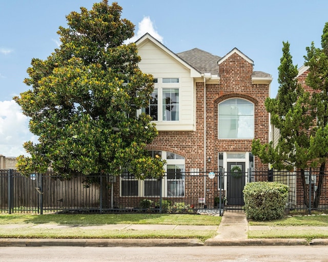 1765 Aden Dr, Houston, TX 77003 - view of front facade with brick siding and a fenced front yard