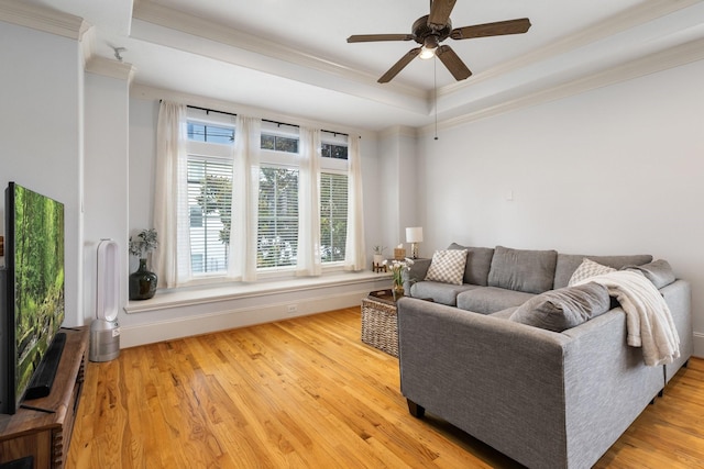 1765 Aden Dr, Houston, TX 77003 - living room featuring crown molding, ceiling fan, wood finished floors, and a raised ceiling