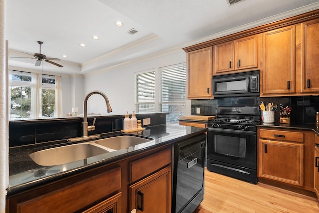 1765 Aden Dr, Houston, TX 77003 - kitchen with black appliances, dark countertops, ceiling fan, backsplash, and recessed lighting