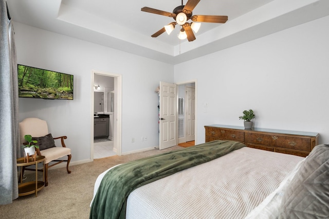 1765 Aden Dr, Houston, TX 77003 - bedroom with light colored carpet, a raised ceiling, and a ceiling fan