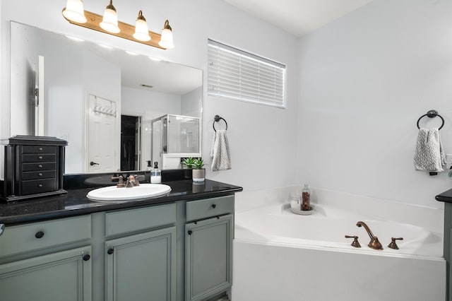 1765 Aden Dr, Houston, TX 77003 - full bath with vanity, a bath, and a shower stall