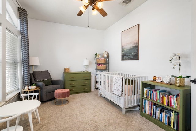 1765 Aden Dr, Houston, TX 77003 - bedroom featuring carpet, a crib, and a ceiling fan