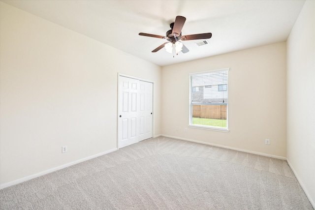 22611 Pineleigh Ct, Tomball, TX 77375 - empty room featuring light colored carpet and a ceiling fan