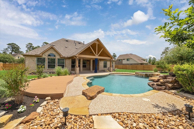 22611 Pineleigh Ct, Tomball, TX 77375 - view of pool featuring a fenced backyard, a wooden deck, a pool with connected hot tub, and a patio