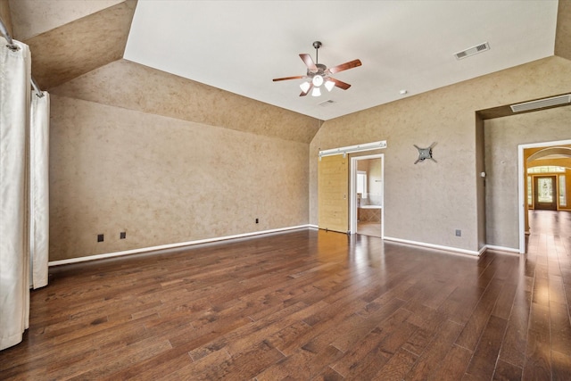22611 Pineleigh Ct, Tomball, TX 77375 - unfurnished room with vaulted ceiling, hardwood / wood-style floors, a ceiling fan, and arched walkways